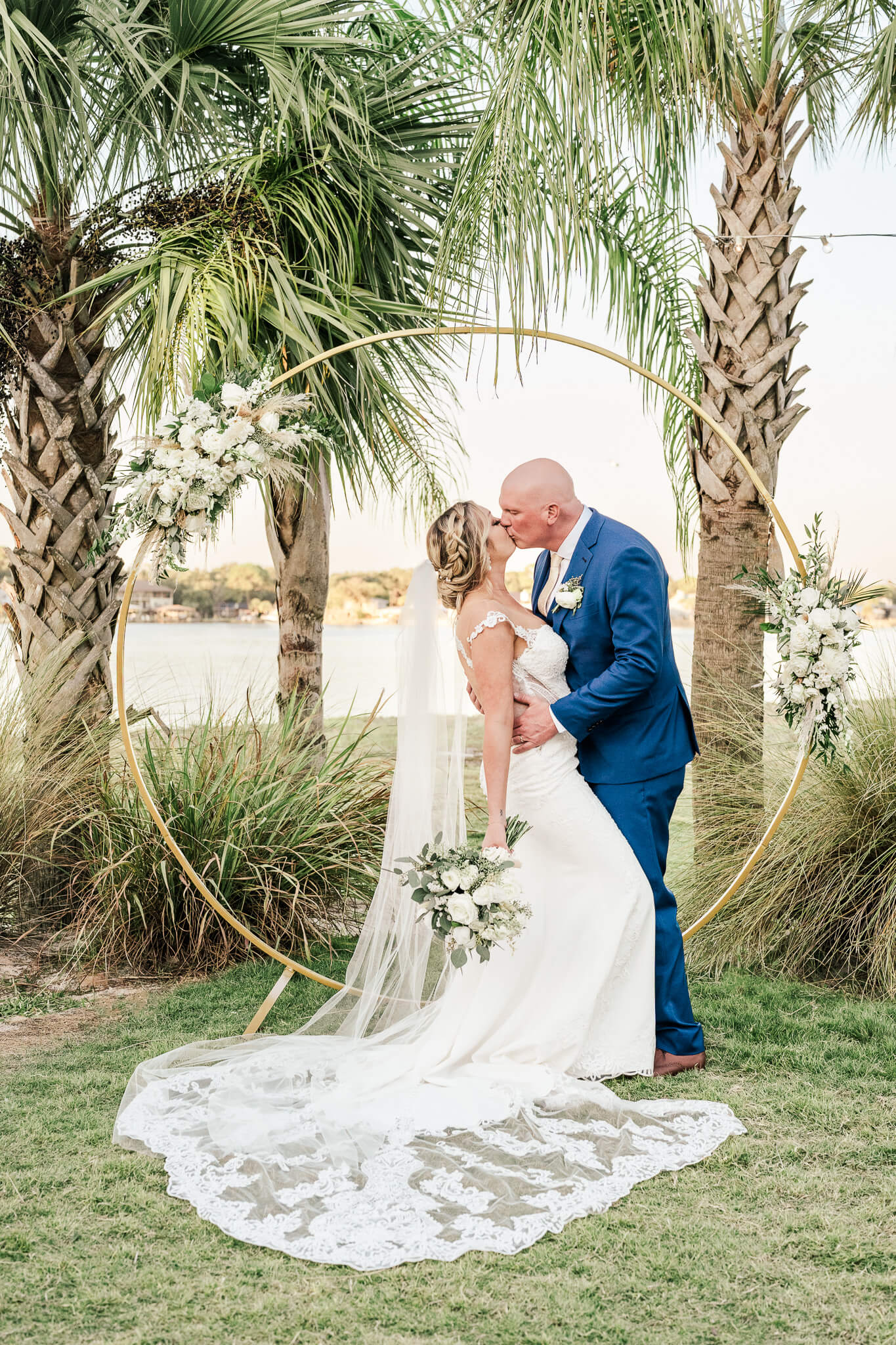 Bride and groom kiss for their coastal 30A wedding video