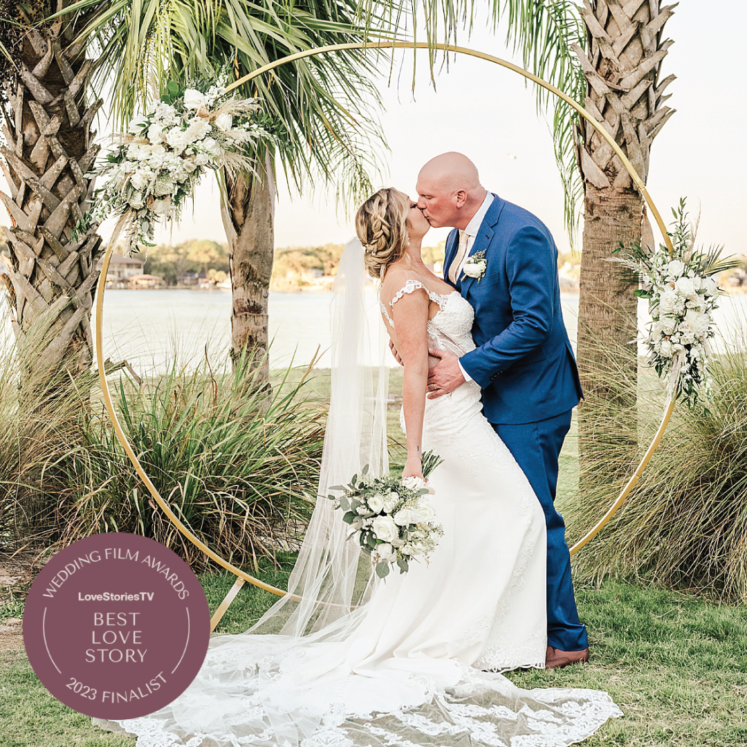 Bride and groom kiss for their coastal 30A wedding video