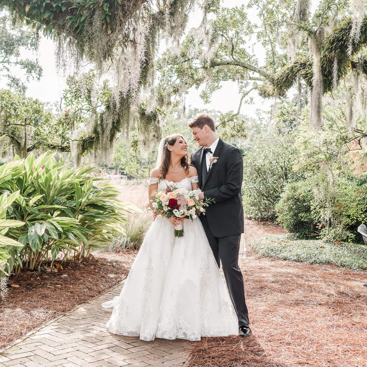 Bride and groom smile at each other at The Grand Hotel for their Fairhope wedding video