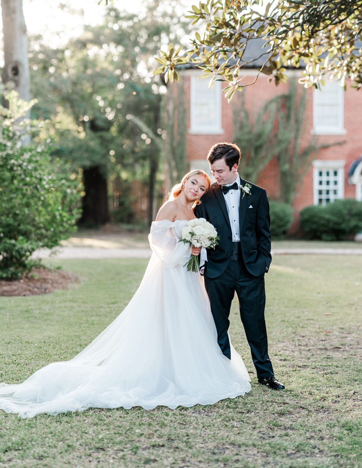 Bride leans her head on groom's shoulder at The 1616 House in Montgomery, AL.