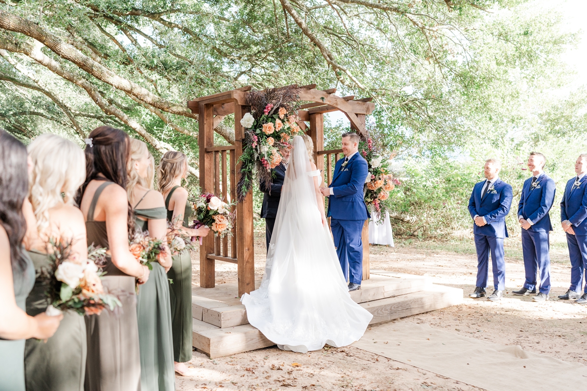 Fall boho Fairhope wedding in a tunnel of oak trees at Oak Hollow Farm in Alabama